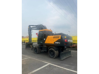 Ratinis ekskavatorius HYUNDAI R210