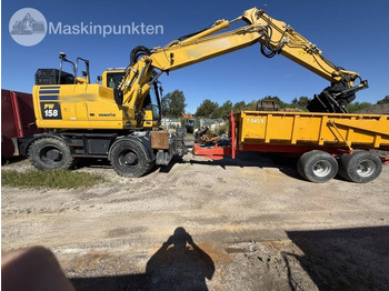Ratinis ekskavatorius KOMATSU