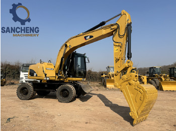 Ratinis ekskavatorius CATERPILLAR M320