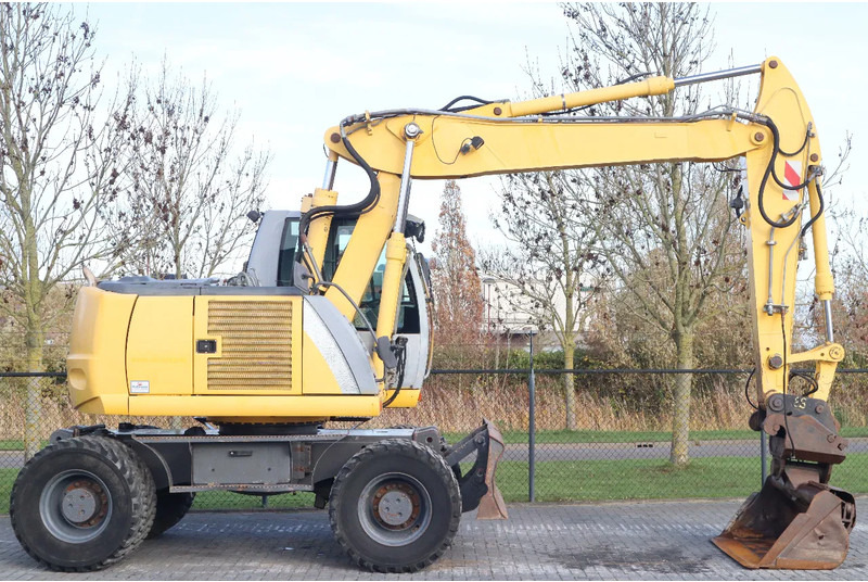 New Holland MH CITY | TILT BUCKET | QUICK COUPLER | DOZER BLADE - Ratinis ekskavatorius: foto 4 New Holland MH CITY | TILT BUCKET | QUICK COUPLER | DOZER BLADE - Ratinis ekskavatorius: foto 4