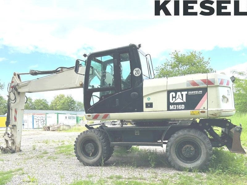 CAT M 316 D - Ratinis ekskavatorius: foto 1 CAT M 316 D - Ratinis ekskavatorius: foto 1