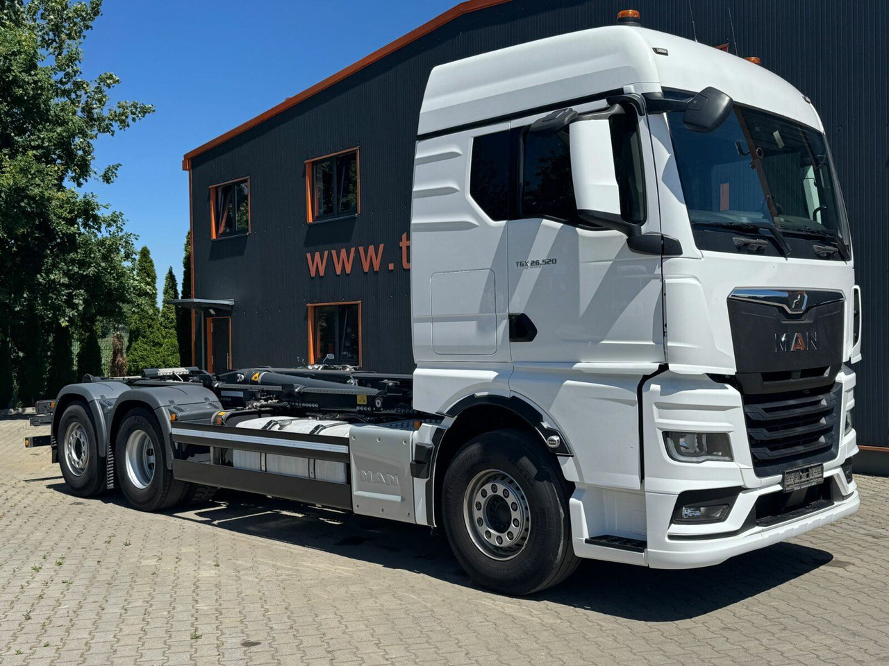 MAN TGX 26.520 6x2 Abrollkipper MEILLER RS 21.70 - Hook-lift sunkvežimis: foto 1 MAN TGX 26.520 6x2 Abrollkipper MEILLER RS 21.70 - Hook-lift sunkvežimis: foto 1