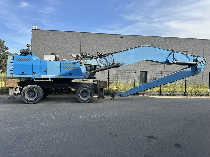 Fuchs MHL 360 OVERSLAGKRAAN / MATERIAL HANDLER / UMSCHLAGBAGGER - TOP ZUSTAND - Ekskavatorius su ilga strėle: foto 1 Fuchs MHL 360 OVERSLAGKRAAN / MATERIAL HANDLER / UMSCHLAGBAGGER - TOP ZUSTAND - Ekskavatorius su ilga strėle: foto 1