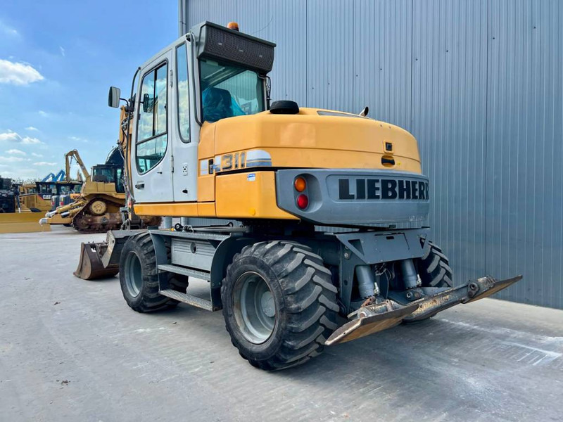 Liebherr A311 Litronic - Ratinis ekskavatorius: foto 2 Liebherr A311 Litronic - Ratinis ekskavatorius: foto 2