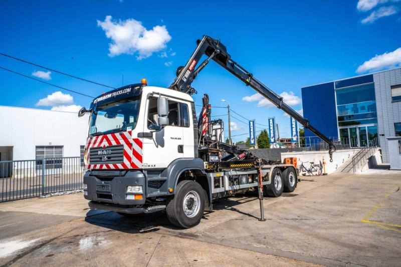 MAN TGA 26.320 BL -6X2-4+HIAB 122 E3 HIDUO - Hook-lift sunkvežimis, Sunkvežimis su kranu: foto 1 MAN TGA 26.320 BL -6X2-4+HIAB 122 E3 HIDUO - Hook-lift sunkvežimis, Sunkvežimis su kranu: foto 1
