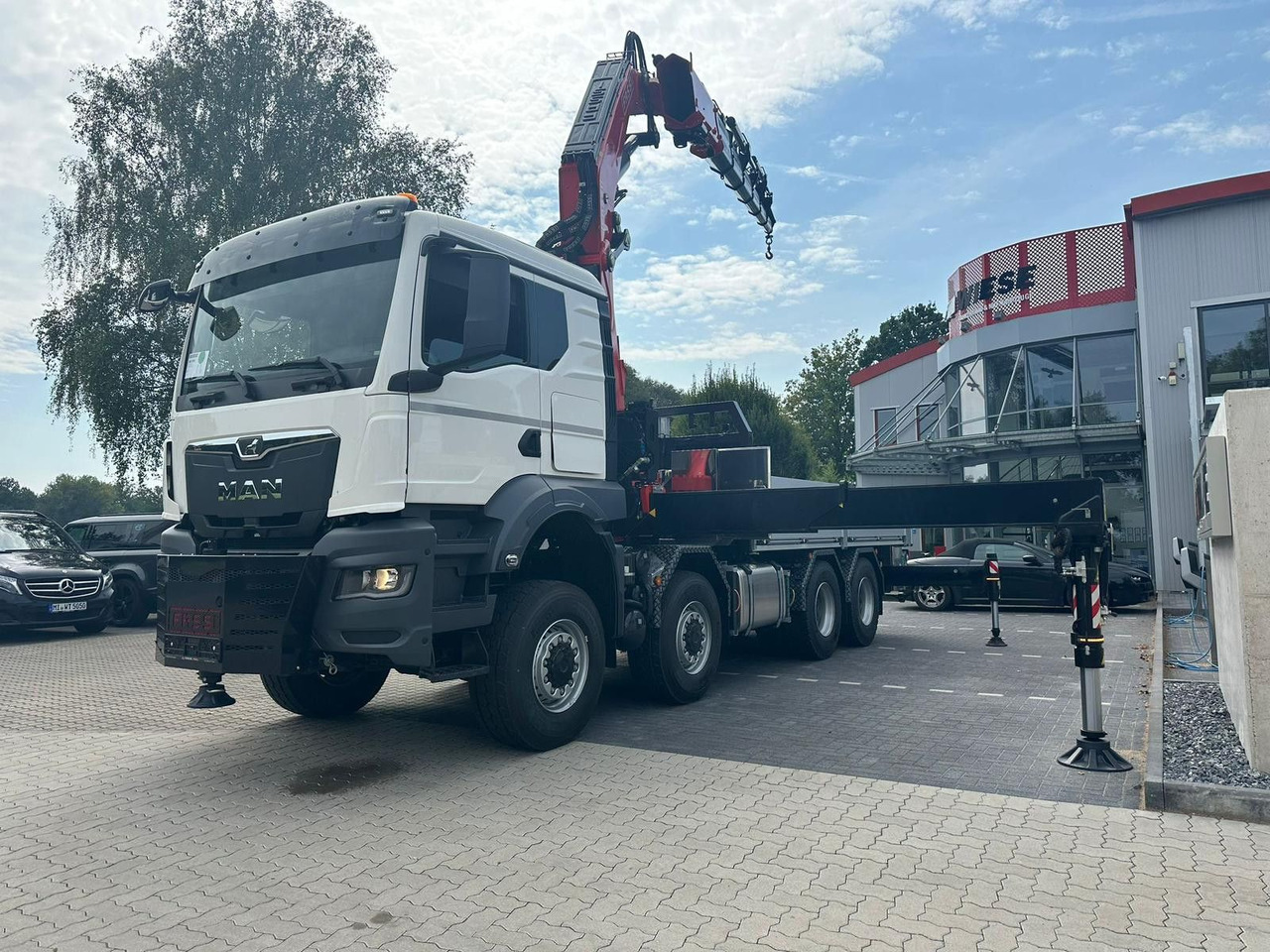 MAN TGS 41.520 8x8 mit Fassi Ladekran F710RA.2.26 - Platforminis/ Bortinis sunkvežimis: foto 2 MAN TGS 41.520 8x8 mit Fassi Ladekran F710RA.2.26 - Platforminis/ Bortinis sunkvežimis: foto 2