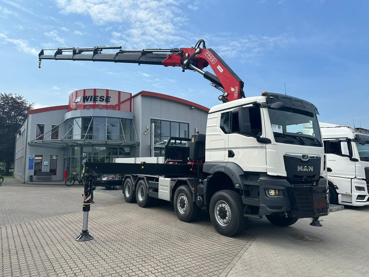 MAN TGS 41.520 8x8 mit Fassi Ladekran F710RA.2.26 - Platforminis/ Bortinis sunkvežimis: foto 1 MAN TGS 41.520 8x8 mit Fassi Ladekran F710RA.2.26 - Platforminis/ Bortinis sunkvežimis: foto 1