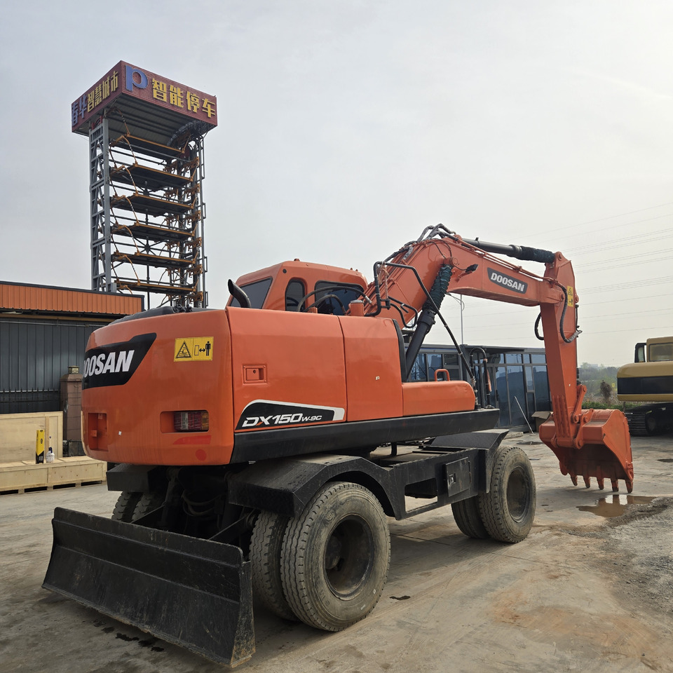 DOOSAN DX150W - Ratinis ekskavatorius: foto 5 DOOSAN DX150W - Ratinis ekskavatorius: foto 5