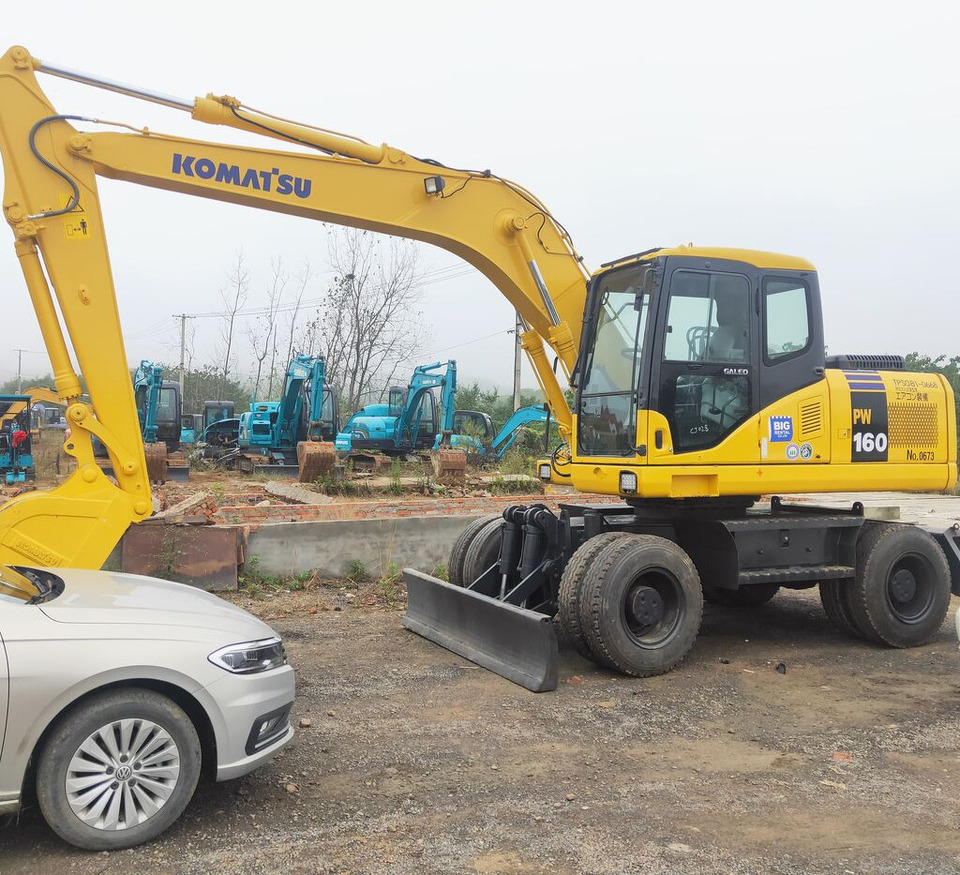Komatsu PW160 - Ratinis ekskavatorius: foto 1 Komatsu PW160 - Ratinis ekskavatorius: foto 1