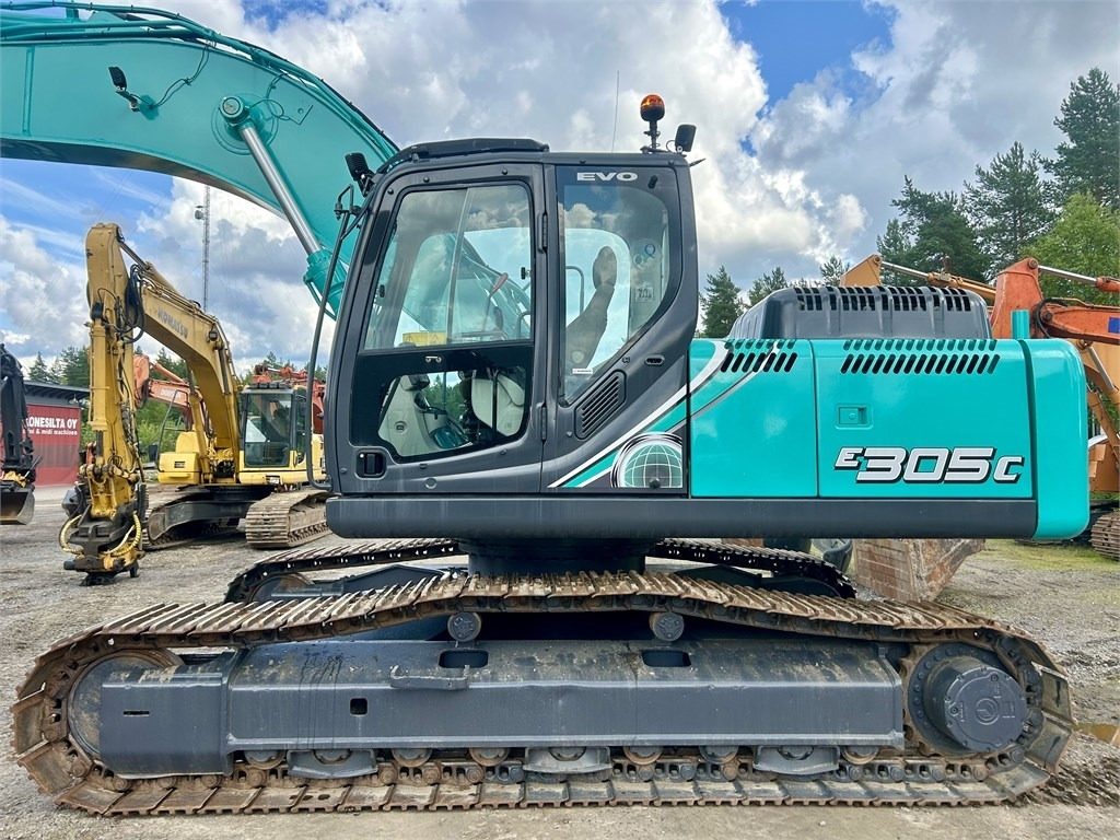 New Holland Kobelco E305C EVO - Vikšrinis ekskavatorius: foto 2 New Holland Kobelco E305C EVO - Vikšrinis ekskavatorius: foto 2