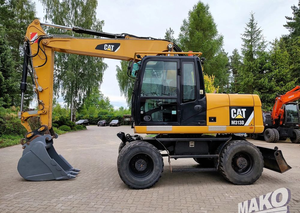 Caterpillar M313D - Ratinis ekskavatorius: foto 1 Caterpillar M313D - Ratinis ekskavatorius: foto 1