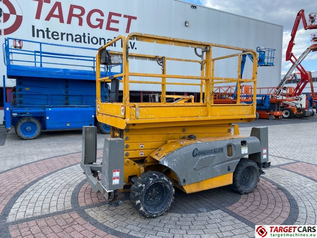 Haulotte Compact 12DX Diesel 4x4 Scissor Work Lift 1206cm - Žirklinis keltuvas: foto 1 Haulotte Compact 12DX Diesel 4x4 Scissor Work Lift 1206cm - Žirklinis keltuvas: foto 1