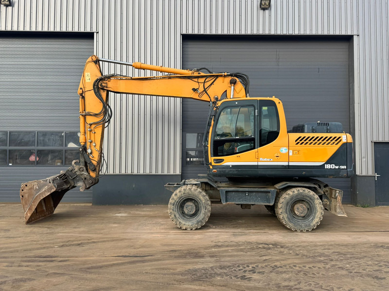 Hyundai Robex 180W-9A - Ratinis ekskavatorius: foto 1 Hyundai Robex 180W-9A - Ratinis ekskavatorius: foto 1