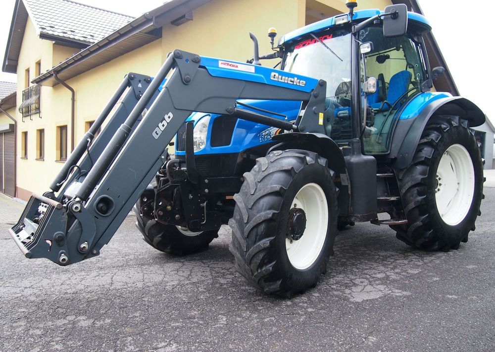 Ciągnik New Holland NH TS125A 6 cylindrów 2004 Ciągnik rolniczy New Holland TS125A - Traktorius: foto 1 Ciągnik New Holland NH TS125A 6 cylindrów 2004 Ciągnik rolniczy New Holland TS125A - Traktorius: foto 1