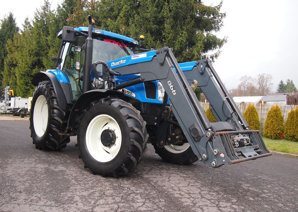 Ciągnik New Holland NH TS125A 6 cylindrów 2004 Ciągnik rolniczy New Holland TS125A - Traktorius: foto 2 Ciągnik New Holland NH TS125A 6 cylindrów 2004 Ciągnik rolniczy New Holland TS125A - Traktorius: foto 2