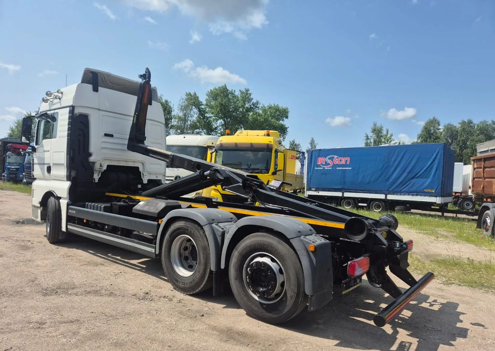 MAN TGX 26-460 Hakowiec oś skrętna - Hook-lift sunkvežimis: foto 1 MAN TGX 26-460 Hakowiec oś skrętna - Hook-lift sunkvežimis: foto 1