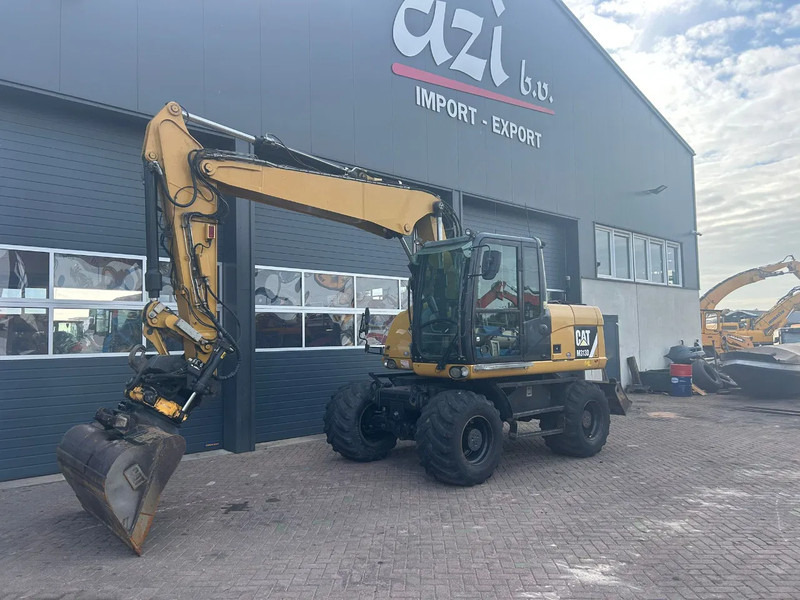 Caterpillar M313D - Ratinis ekskavatorius: foto 1 Caterpillar M313D - Ratinis ekskavatorius: foto 1