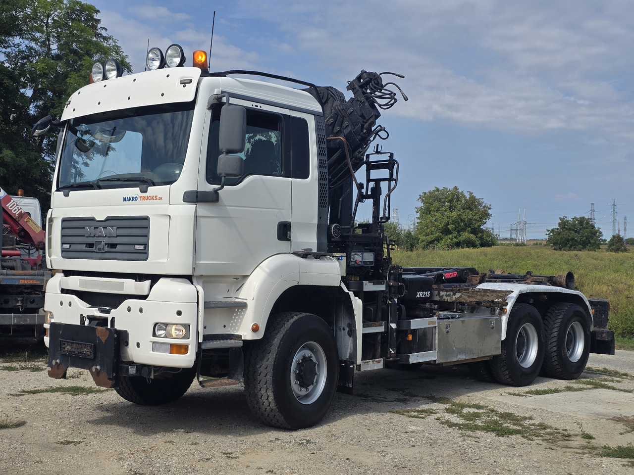 MAN TGA 26.440 6X6 / HOOK SYSTEM / HIAB 166D REMOTE SPECIAL PRICE ONLY THIS YEAR - Hook-lift sunkvežimis, Sunkvežimis su kranu: foto 1 MAN TGA 26.440 6X6 / HOOK SYSTEM / HIAB 166D REMOTE SPECIAL PRICE ONLY THIS YEAR - Hook-lift sunkvežimis, Sunkvežimis su kranu: foto 1