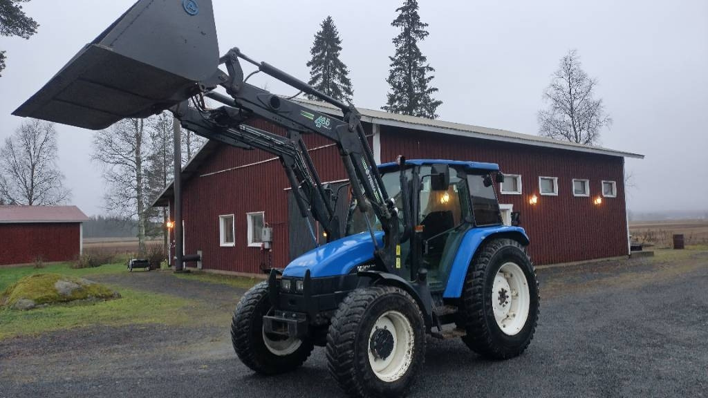 New Holland TL90 trima kuormaaja, sähköinen suunnanvaihtaja - Traktorius: foto 1 New Holland TL90 trima kuormaaja, sähköinen suunnanvaihtaja - Traktorius: foto 1