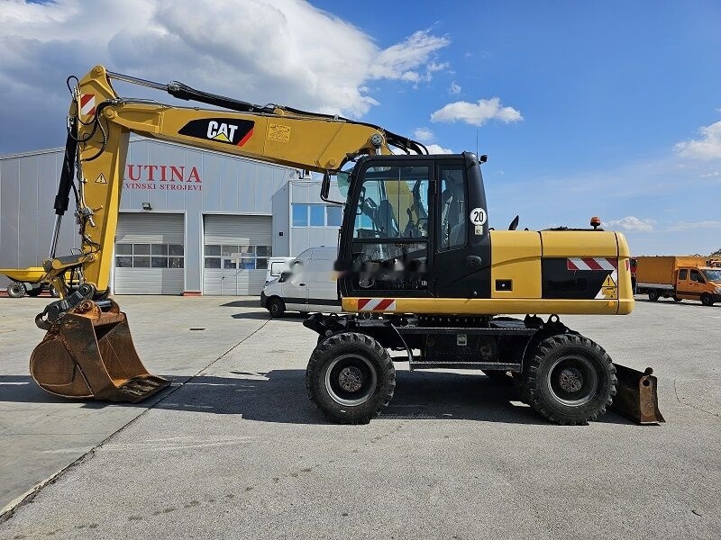 Caterpillar M315D - Ratinis ekskavatorius: foto 1 Caterpillar M315D - Ratinis ekskavatorius: foto 1