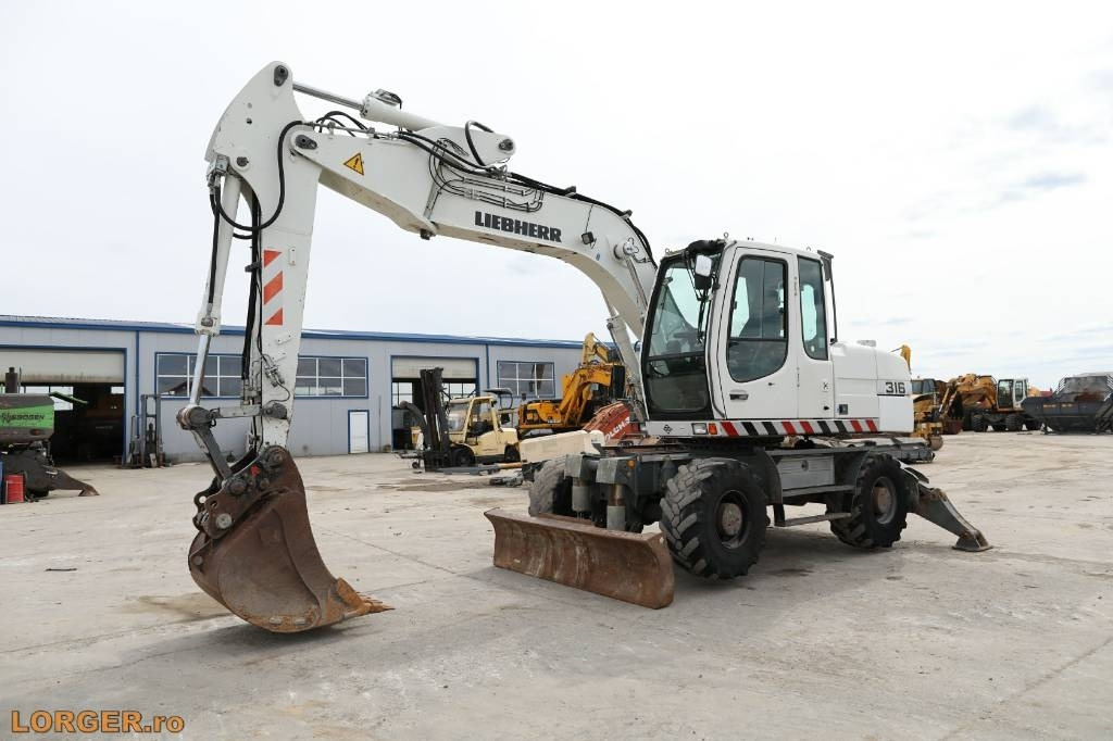 Liebherr A 316 Litronic - Ratinis ekskavatorius: foto 5 Liebherr A 316 Litronic - Ratinis ekskavatorius: foto 5