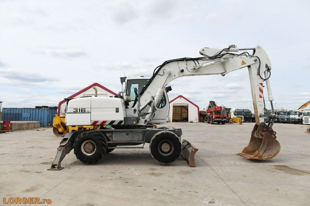 Liebherr A 316 Litronic - Ratinis ekskavatorius: foto 1 Liebherr A 316 Litronic - Ratinis ekskavatorius: foto 1