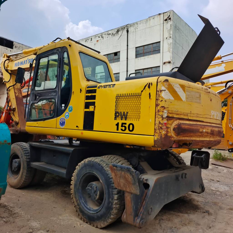Komatsu PW 150 - Ratinis ekskavatorius: foto 1 Komatsu PW 150 - Ratinis ekskavatorius: foto 1