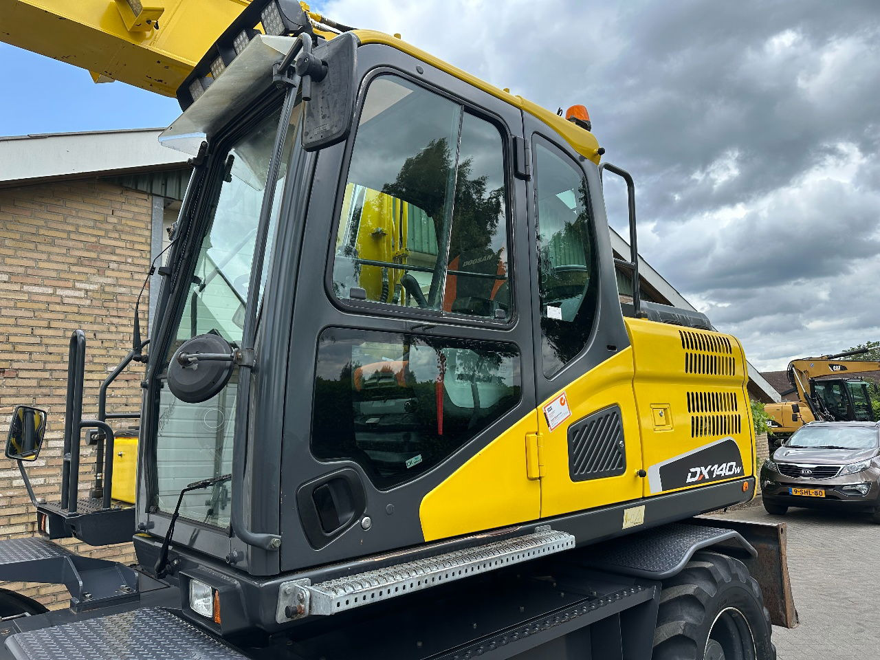 Doosan DX140W-5 - Ratinis ekskavatorius: foto 3 Doosan DX140W-5 - Ratinis ekskavatorius: foto 3