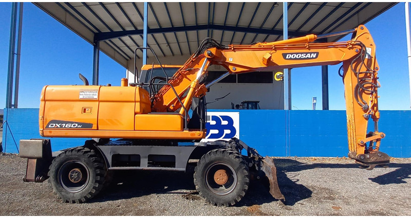 Doosan DX140W-3 - Ratinis ekskavatorius: foto 2 Doosan DX140W-3 - Ratinis ekskavatorius: foto 2