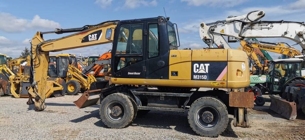 CAT M 315 D - Ratinis ekskavatorius: foto 4 CAT M 315 D - Ratinis ekskavatorius: foto 4