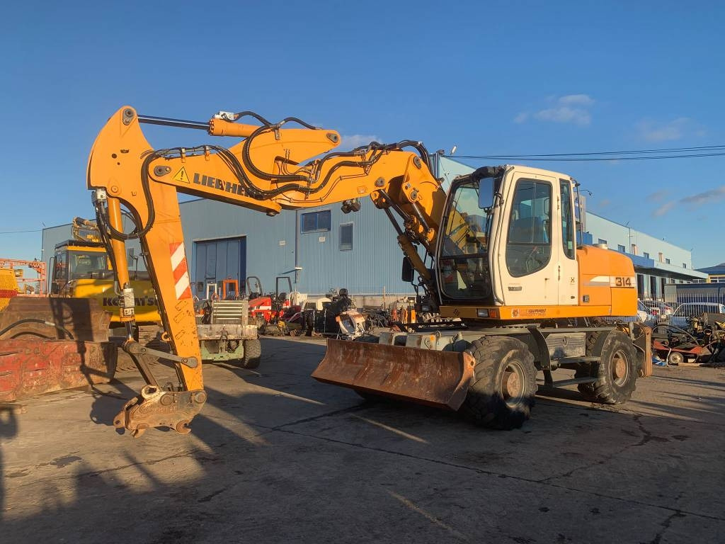 Liebherr A 314 Litronic - Ratinis ekskavatorius: foto 1 Liebherr A 314 Litronic - Ratinis ekskavatorius: foto 1