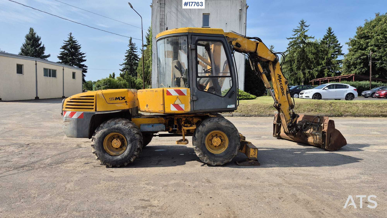 MECALAC 12MX wheeled excavator (1996) - Ratinis ekskavatorius: foto 4 MECALAC 12MX wheeled excavator (1996) - Ratinis ekskavatorius: foto 4
