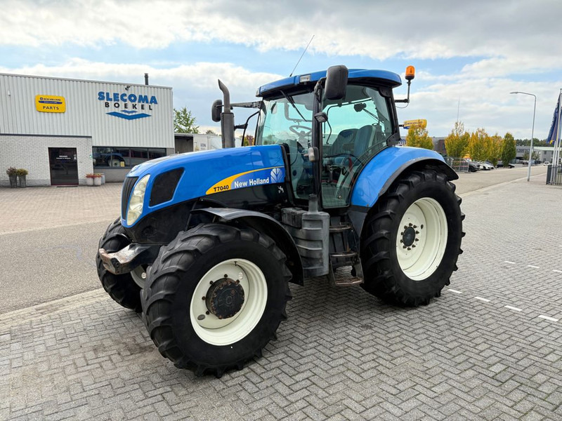New Holland T7040 Power Command - Traktorius: foto 1 New Holland T7040 Power Command - Traktorius: foto 1