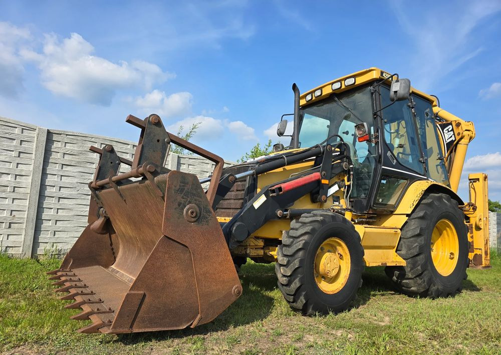 Caterpillar - Ekskavatorius-krautuvas: foto 1 Caterpillar - Ekskavatorius-krautuvas: foto 1