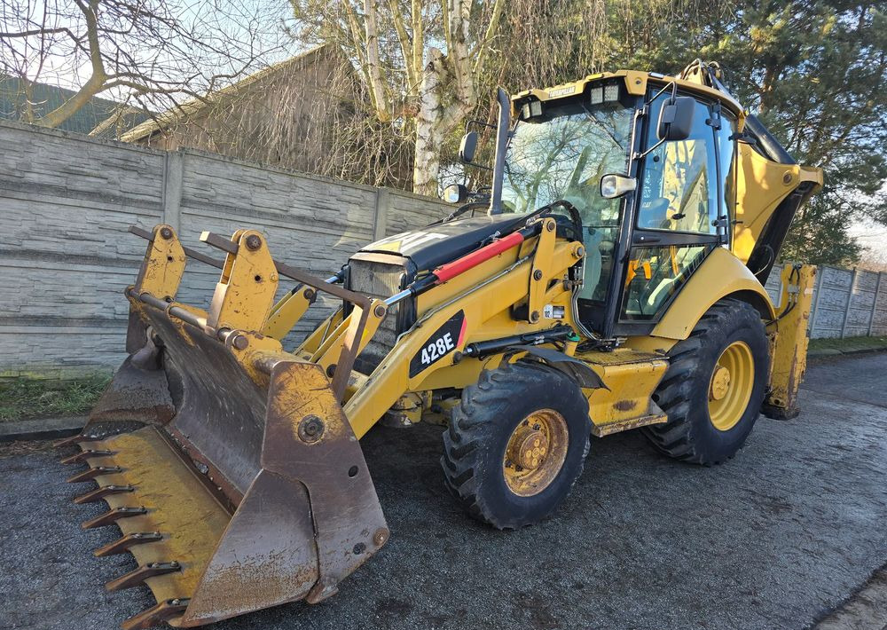 Caterpillar - Ekskavatorius-krautuvas: foto 1 Caterpillar - Ekskavatorius-krautuvas: foto 1