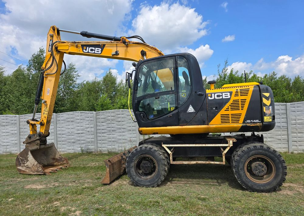 JCB - Ratinis ekskavatorius: foto 1 JCB - Ratinis ekskavatorius: foto 1