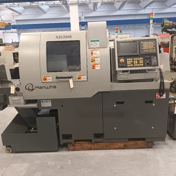 Tornio a fantina mobile a 5 assi Cnc Hanwha XD-20H - Metalo tekinimo staklės: foto 1 Tornio a fantina mobile a 5 assi Cnc Hanwha XD-20H - Metalo tekinimo staklės: foto 1