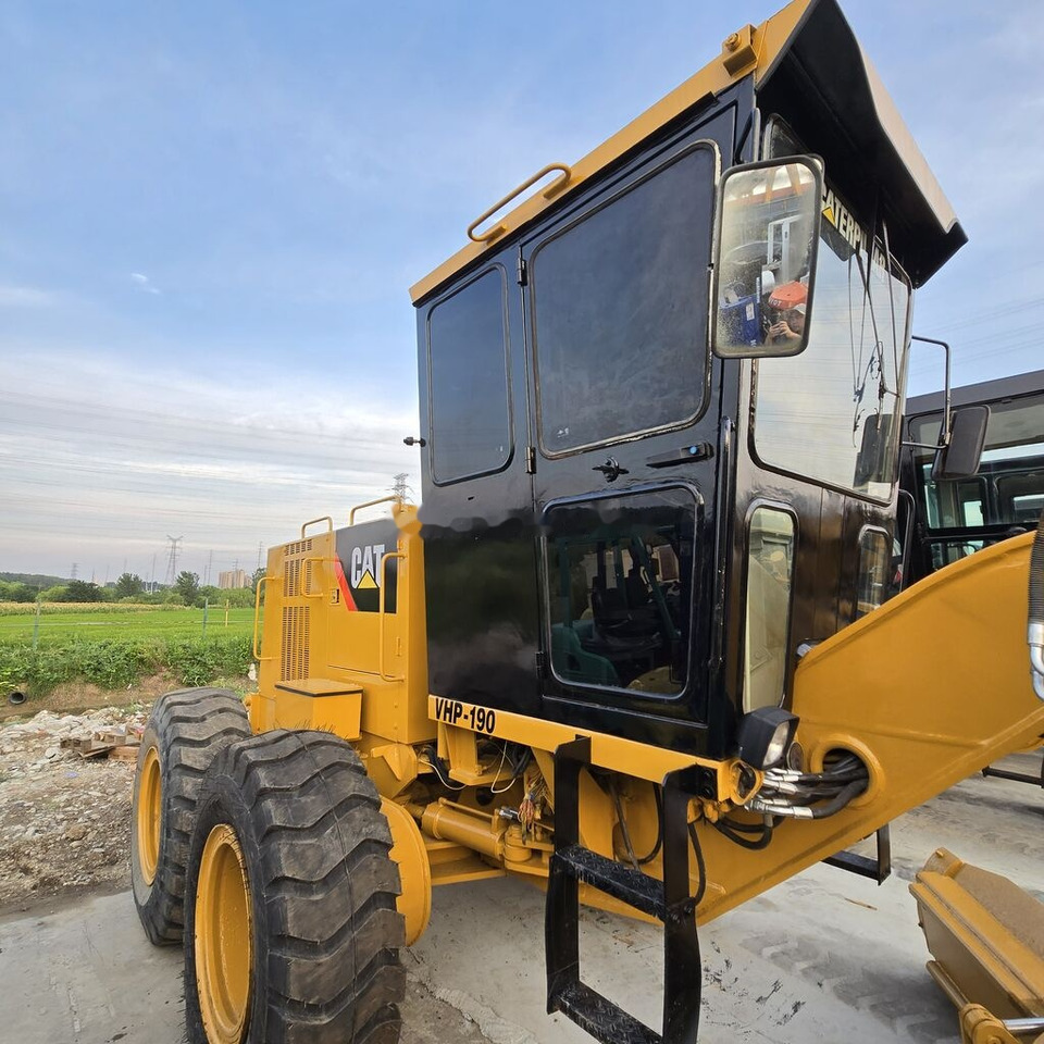 Greideris Caterpillar 140K: foto 7