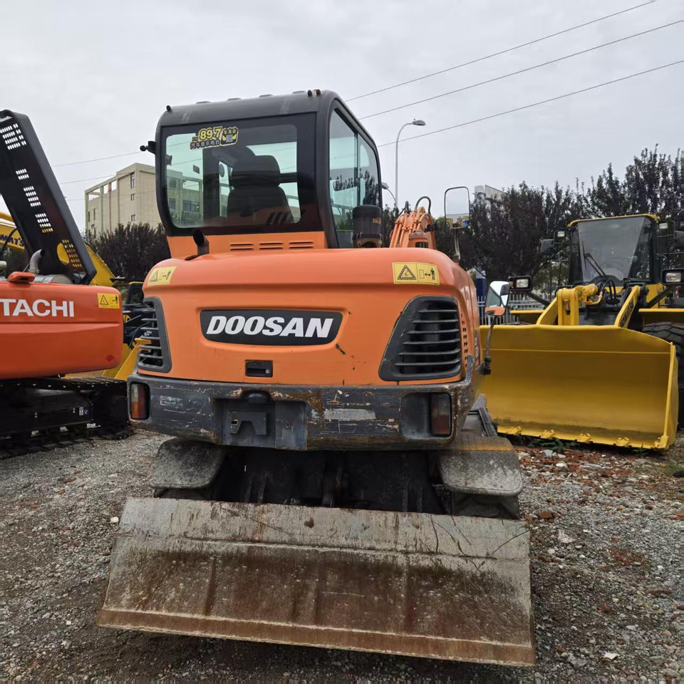 DOOSAN DX60W - Ratinis ekskavatorius: foto 4 DOOSAN DX60W - Ratinis ekskavatorius: foto 4