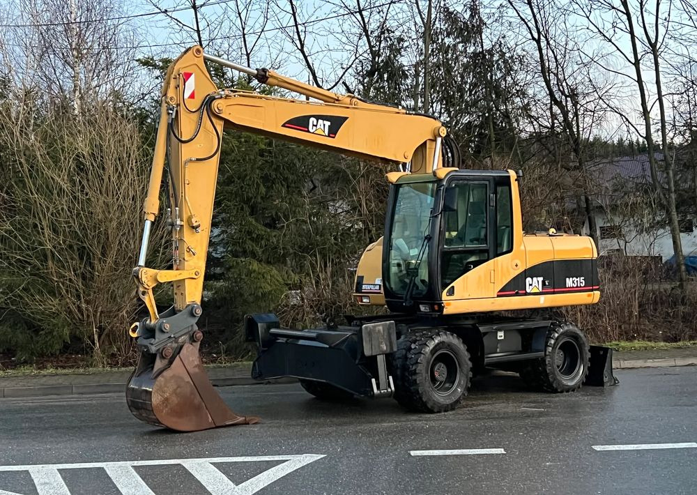 Caterpillar CAT M315C CATERPILLAR SPROWADZONY Bardzo Dobry Stan - Ratinis ekskavatorius: foto 1 Caterpillar CAT M315C CATERPILLAR SPROWADZONY Bardzo Dobry Stan - Ratinis ekskavatorius: foto 1