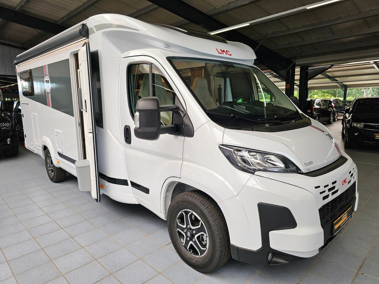 LMC Tourer T660G 70 Jahre AT-8 WC Markise Navi - Pusiau integruotas kemperis: foto 1 LMC Tourer T660G 70 Jahre AT-8 WC Markise Navi - Pusiau integruotas kemperis: foto 1