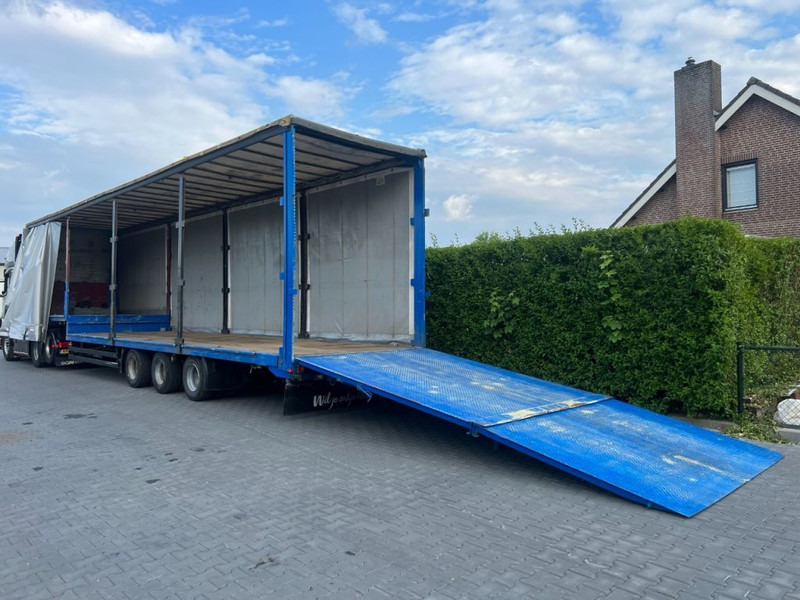 Kögel Semi dieplader met oprijklep - Žemo profilio platforma puspriekabė: foto 1 Kögel Semi dieplader met oprijklep - Žemo profilio platforma puspriekabė: foto 1