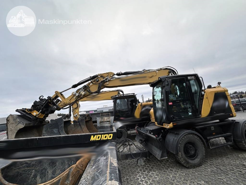 CAT M 315 - Ratinis ekskavatorius: foto 1 CAT M 315 - Ratinis ekskavatorius: foto 1
