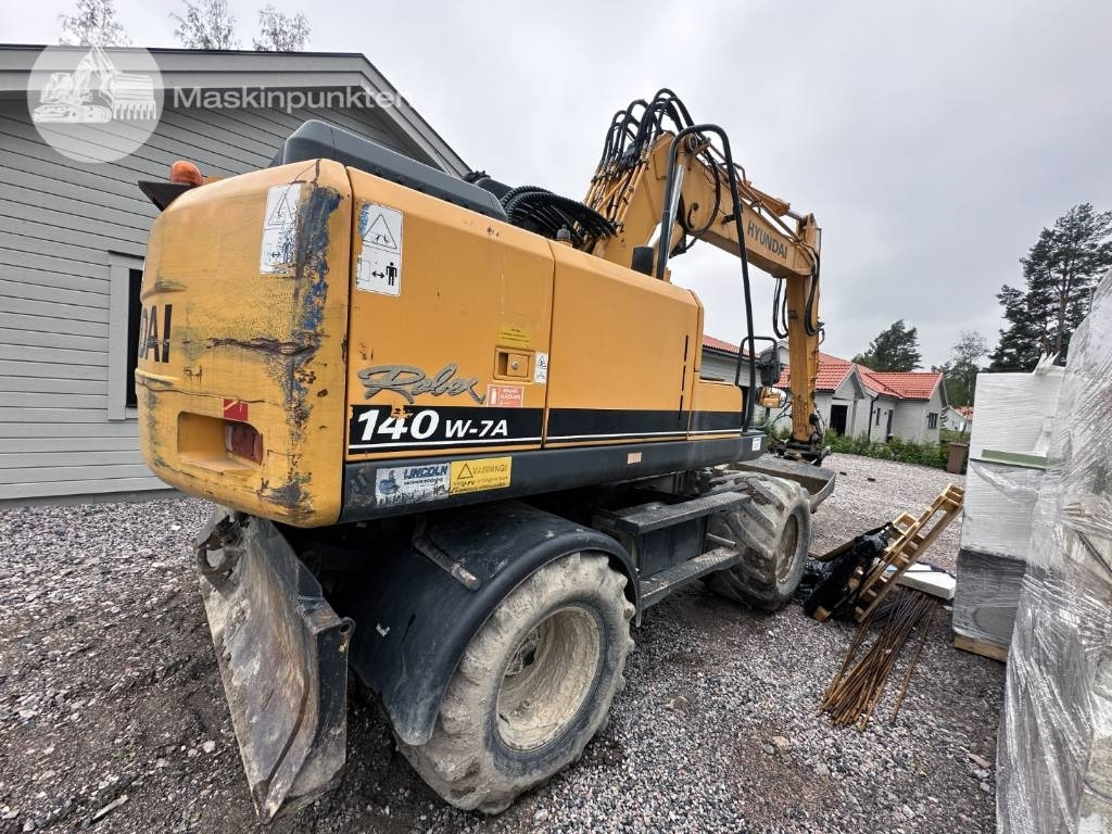 Hyundai Robex 140 W-7 A - Ratinis ekskavatorius: foto 4 Hyundai Robex 140 W-7 A - Ratinis ekskavatorius: foto 4
