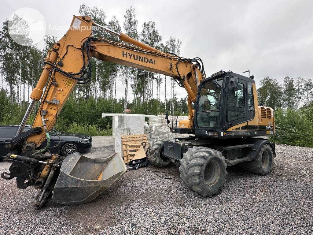 Hyundai Robex 140 W-7 A - Ratinis ekskavatorius: foto 1 Hyundai Robex 140 W-7 A - Ratinis ekskavatorius: foto 1