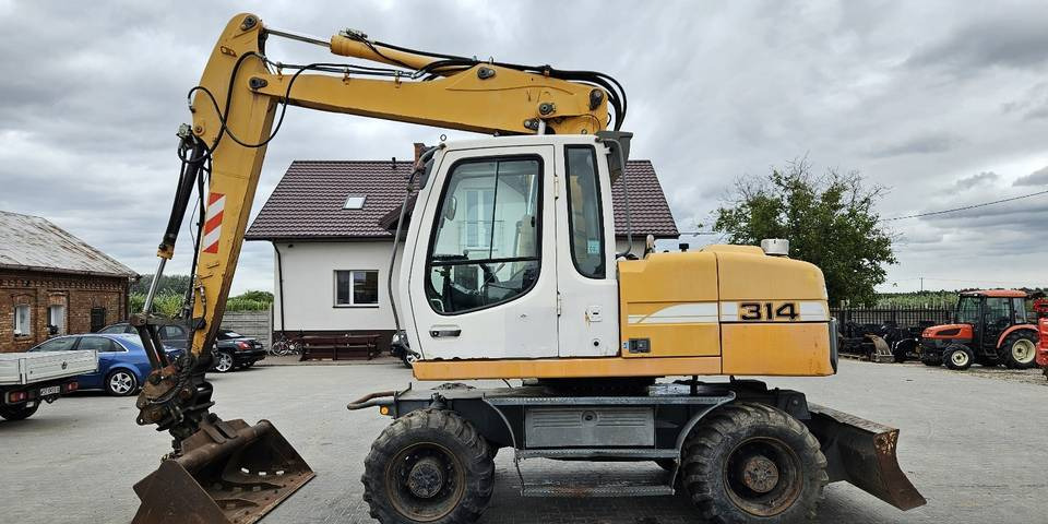 Koparka kołowa Liebherr A314 Litronic 9350 h+ 5 łyżek kołówka - Ratinis ekskavatorius: foto 1 Koparka kołowa Liebherr A314 Litronic 9350 h+ 5 łyżek kołówka - Ratinis ekskavatorius: foto 1