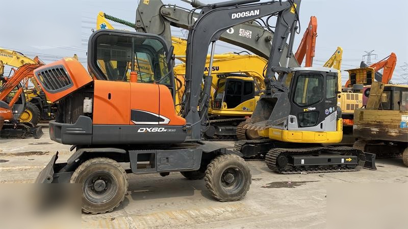 DOOSAN DX60W ECO - Ratinis ekskavatorius: foto 1 DOOSAN DX60W ECO - Ratinis ekskavatorius: foto 1