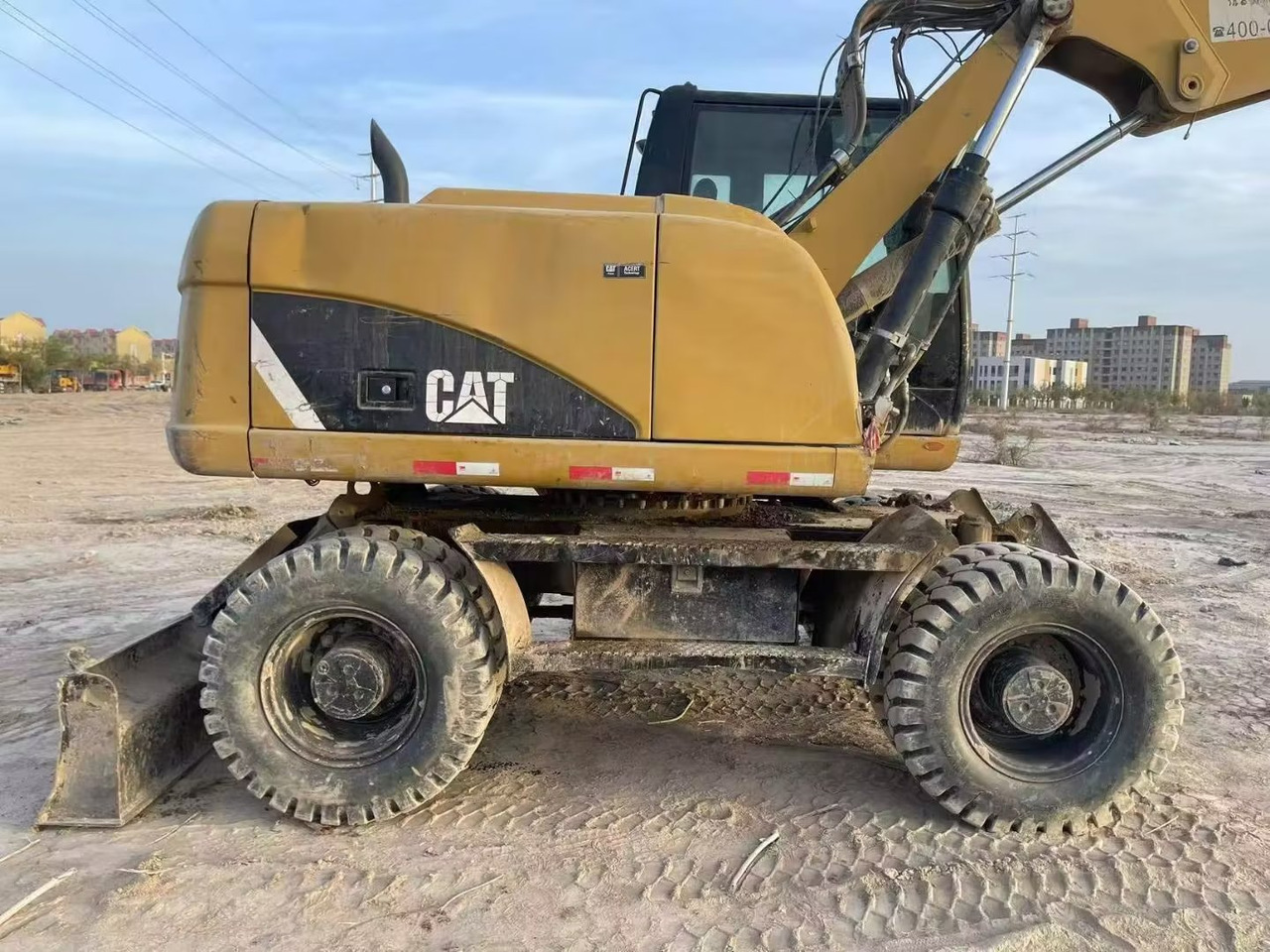 CATERPILLAR M315 - Ratinis ekskavatorius: foto 1 CATERPILLAR M315 - Ratinis ekskavatorius: foto 1