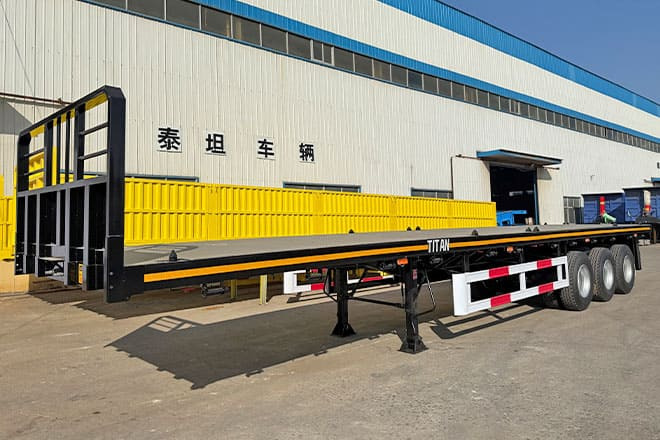 TITAN Tri Axle Flatbed Trailer for Sale in Jamaica - Platforminė/ Bortinė puspriekabė: foto 1 TITAN Tri Axle Flatbed Trailer for Sale in Jamaica - Platforminė/ Bortinė puspriekabė: foto 1