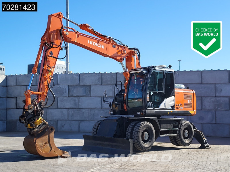 Hitachi ZX140W -5 OUTRIGGERS + BLADE - Ratinis ekskavatorius: foto 1 Hitachi ZX140W -5 OUTRIGGERS + BLADE - Ratinis ekskavatorius: foto 1